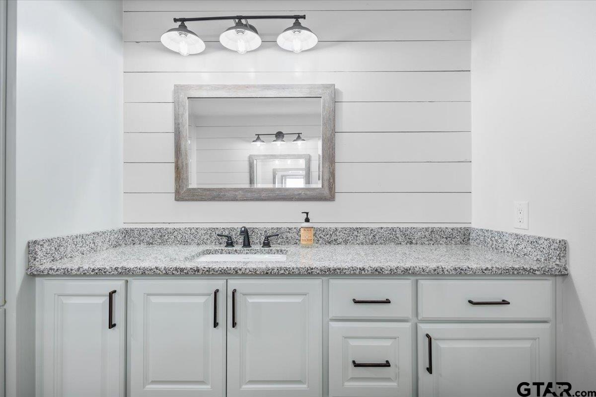 9235 Farm To Market Road 851 Rusk, TX 75785 - Photo 37 of 47 a bathroom with a sink and a mirror