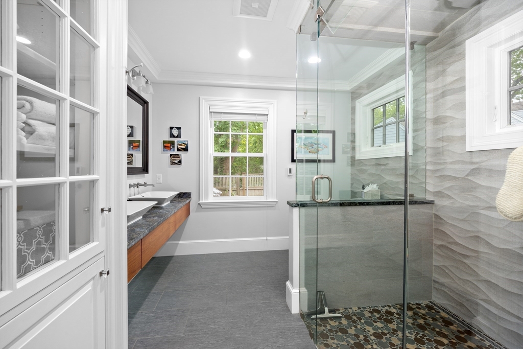 15 Hawthorne Road Hingham, MA 02043 - Photo 16 of 35 a bathroom with a tub and shower