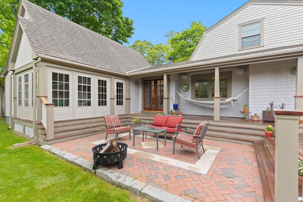 15 Hawthorne Road Hingham, MA 02043 - Photo 26 of 35 a view of a house with backyard sitting area and garden