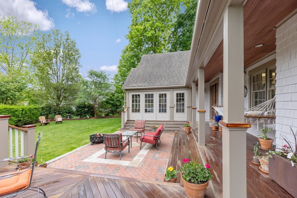 15 Hawthorne Road Hingham, MA 02043 - Photo 28 of 35 a view of a patio with couches table and chairs and potted plants