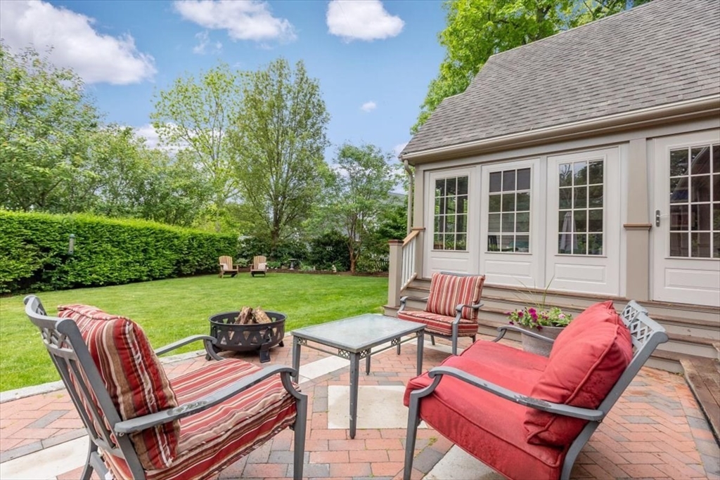 15 Hawthorne Road Hingham, MA 02043 - Photo 33 of 35 a view of a patio with table and chairs with wooden fence