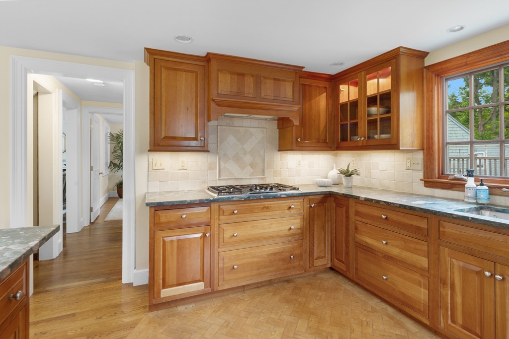 15 Hawthorne Road Hingham, MA 02043 - Photo 8 of 35 a kitchen with granite countertop cabinets stainless steel appliances a sink and a window