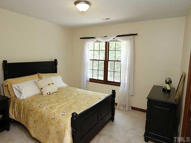 8904 Jeanew Court Raleigh, NC 27613 - Photo 14 of 25 Spacious secondary bedrooms are great to see. There is one on both sides of the wide hall way leading to the bonus room. Bedroom