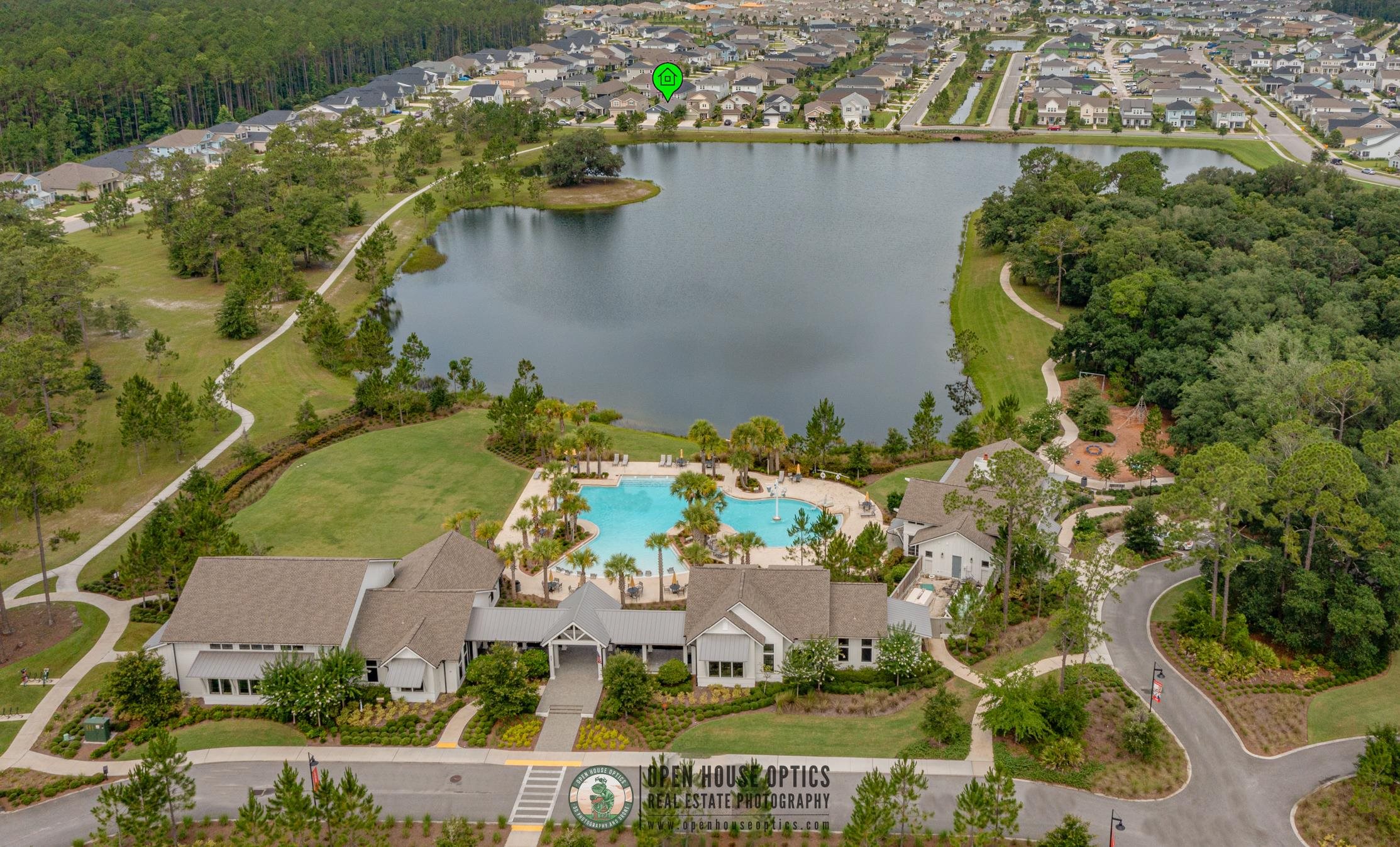210 White Rabbit Run St. Augustine, FL 32092 - Photo 84 of 85 an aerial view of a house with a yard and lake view