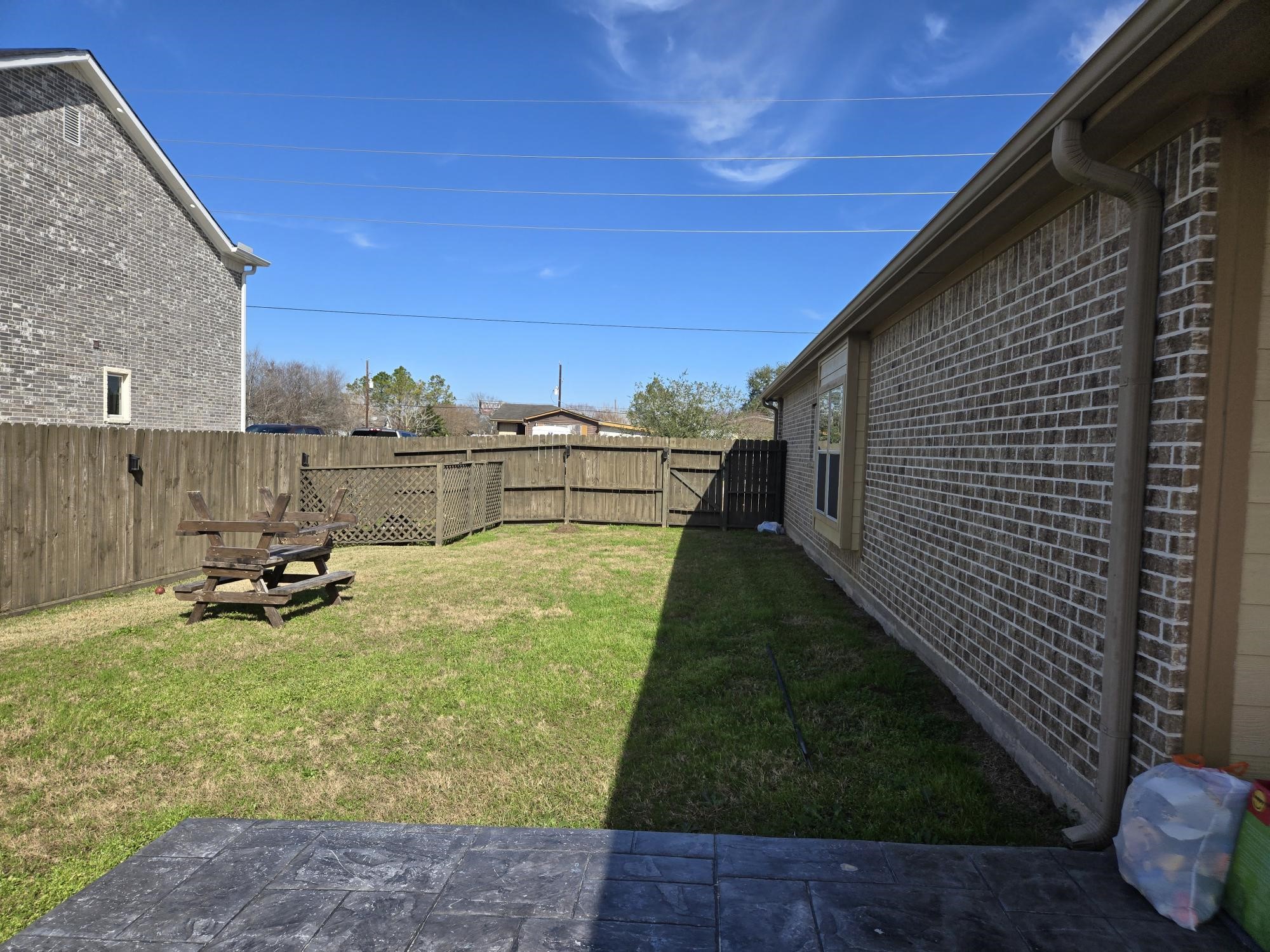 306 Masterson Street Arcola, TX 77583 - Photo 26 of 28 a view of a backyard with sitting area