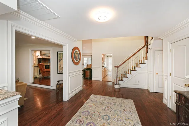 a room with wooden floors and a clock