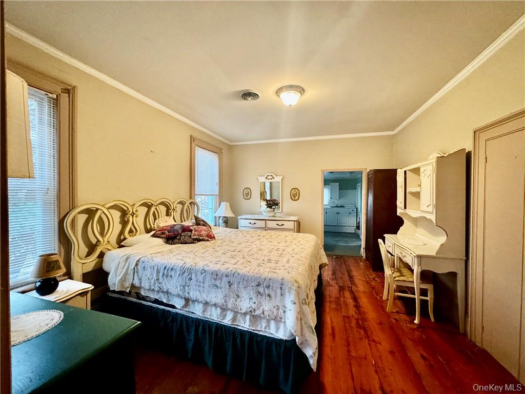 255 Howells Road Middletown, NY 10940 - Photo 30 of 38 a bedroom with a bed and a table in it