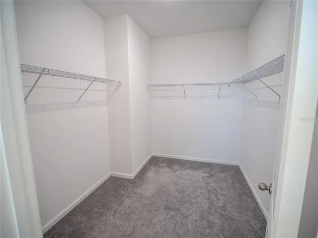 a view of an empty walk in closet