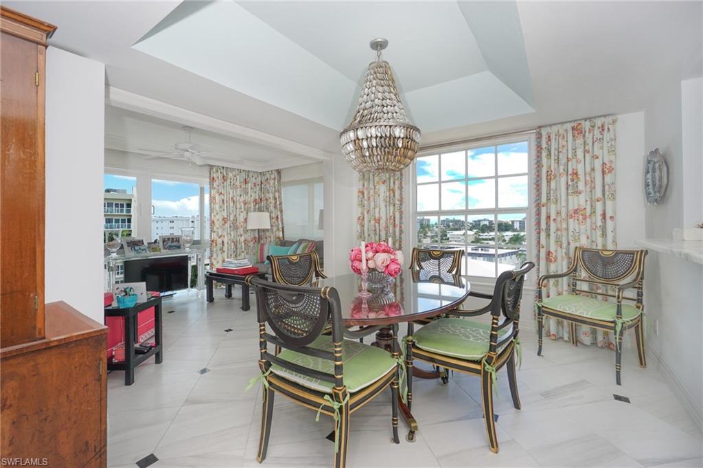 1900 Gulf Shore Boulevard North, Unit 602 Naples, FL 34102 - Photo 12 of 35 a view of a livingroom and dining room