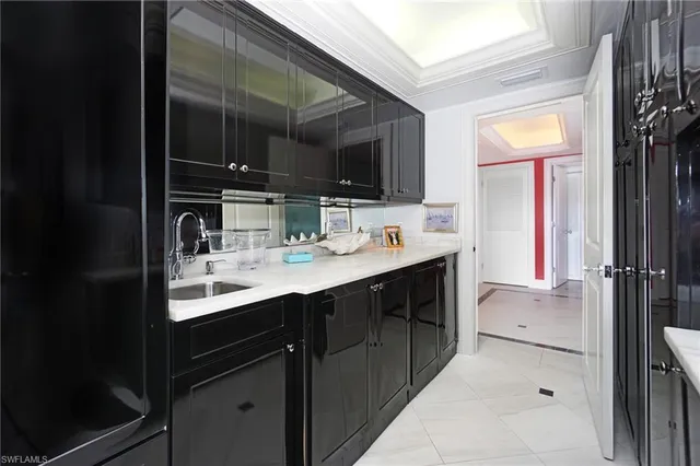 a kitchen with a sink and a refrigerator