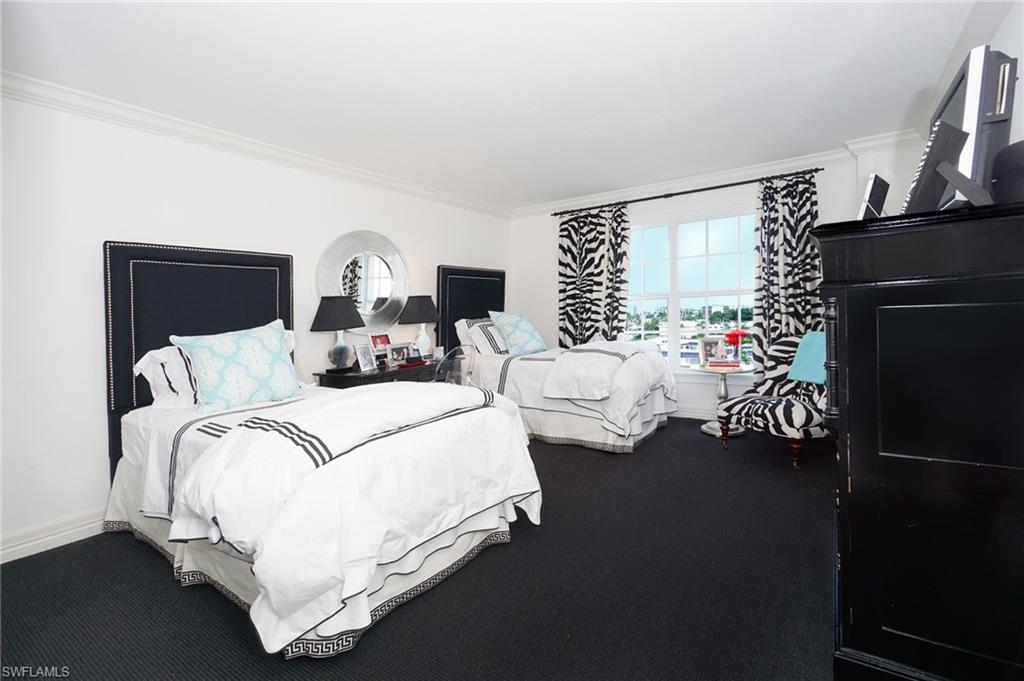 1900 Gulf Shore Boulevard North, Unit 602 Naples, FL 34102 - Photo 23 of 35 a bedroom with bed and window