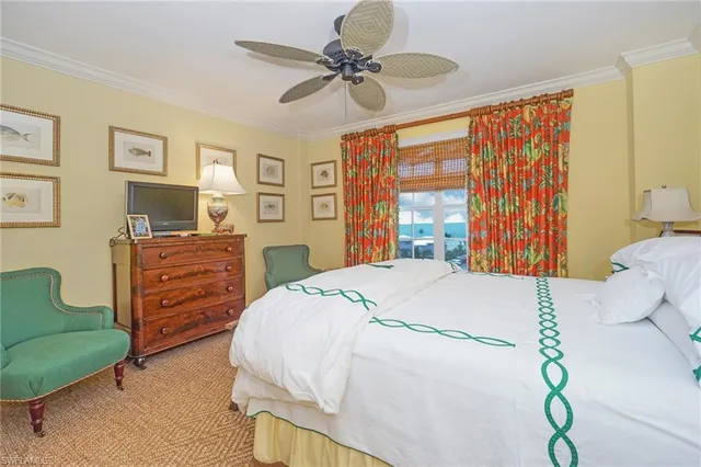 a bedroom with a bed dresser and a window