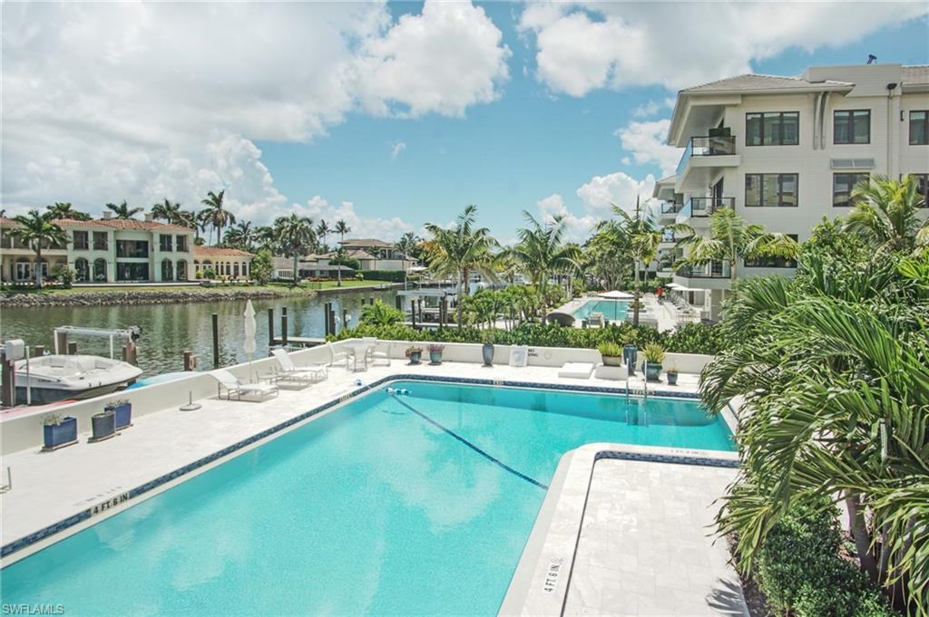 1900 Gulf Shore Boulevard North, Unit 602 Naples, FL 34102 - Photo 33 of 35 a view of a lake with a terrace