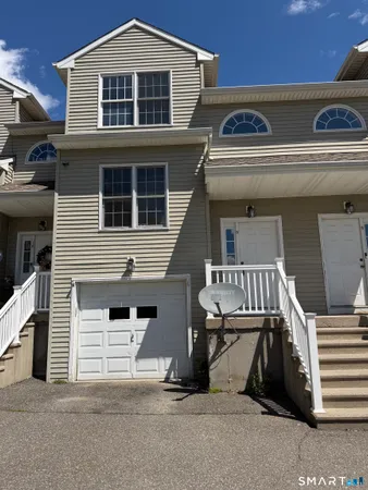 a front view of a house with a garage