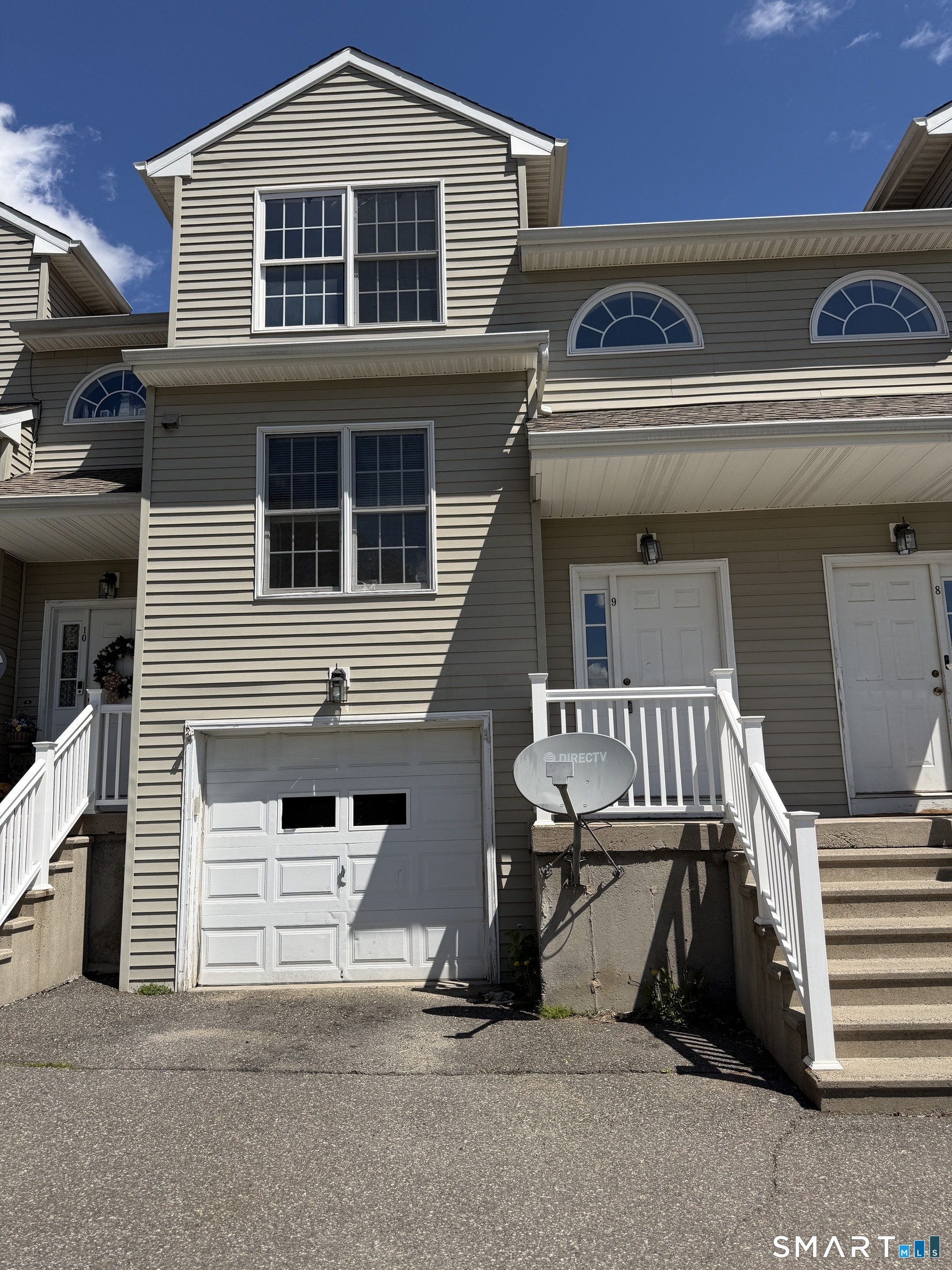 44 Taft Pointe, Unit 9 Waterbury, CT 06708 - Photo 1 of 1 a front view of a house with a garage