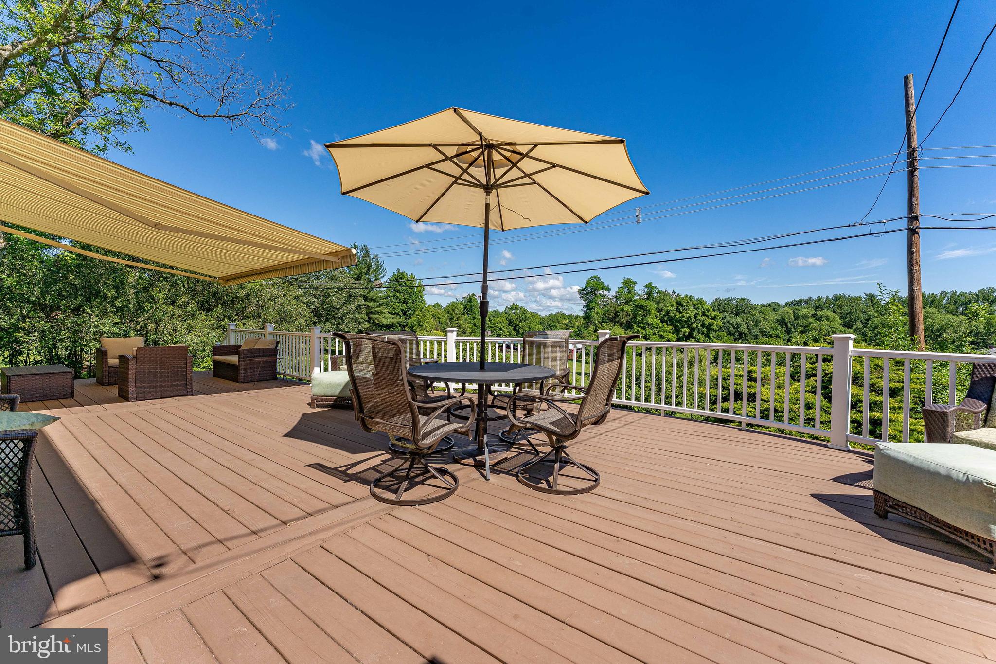 84 North Spring Lane Phoenixville, PA 19460 - Photo 43 of 51 a view of a roof deck with chair and wooden floor