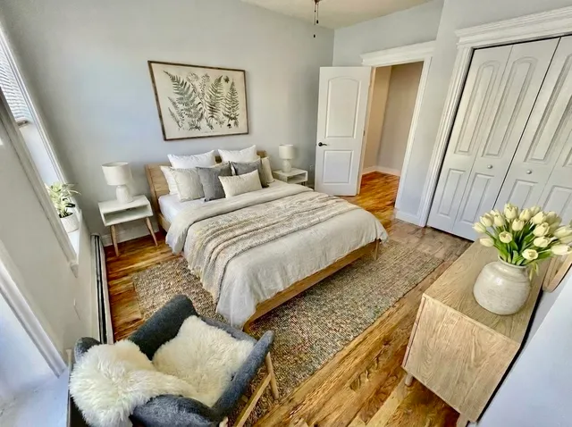 a bedroom with bed and a couch