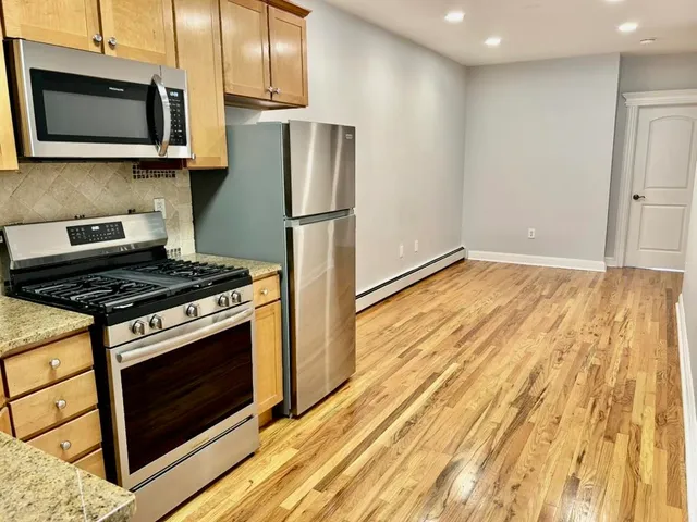 a kitchen with a stove and a microwave