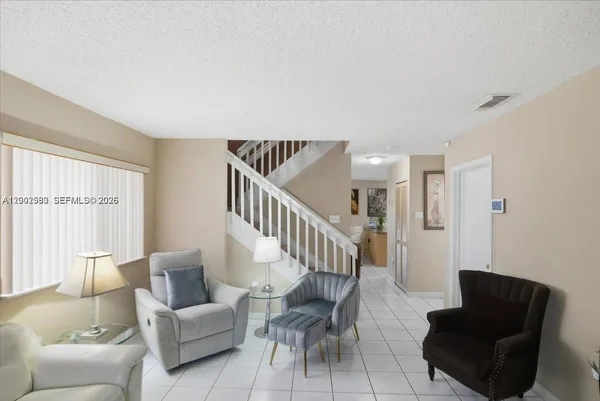 a living room with furniture and a window
