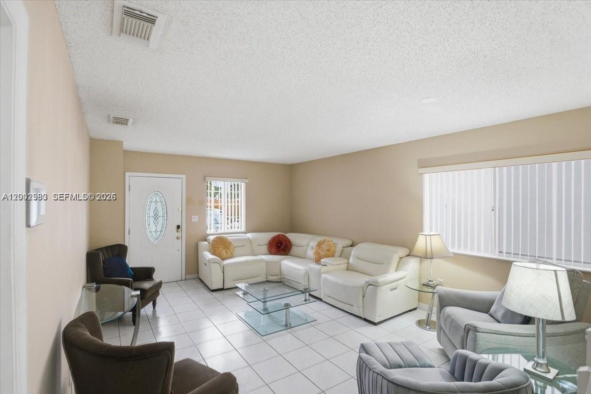 13741 Southwest 160th Terrace Miami, FL 33177 - Photo 17 of 34 a living room with furniture