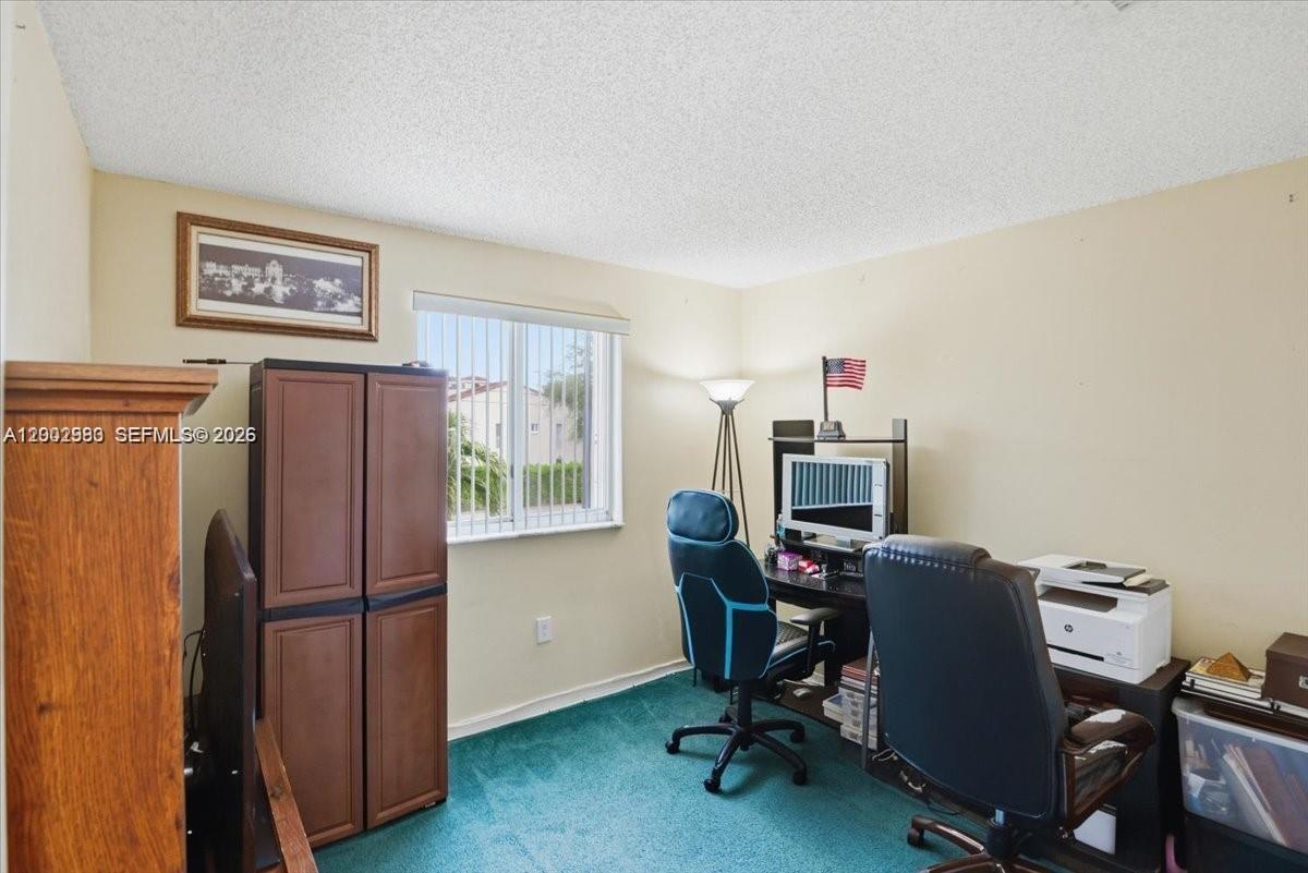 13741 Southwest 160th Terrace Miami, FL 33177 - Photo 20 of 34 a view of a workspace with furniture and a window