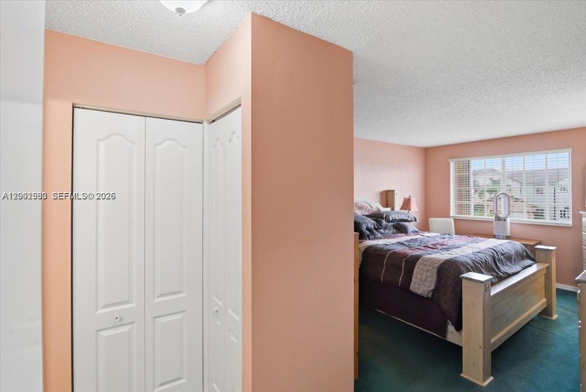 13741 Southwest 160th Terrace Miami, FL 33177 - Photo 28 of 34 a bed room with a bed and a window