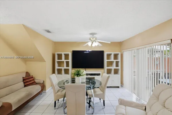 a view of a livingroom with furniture and a flat screen tv