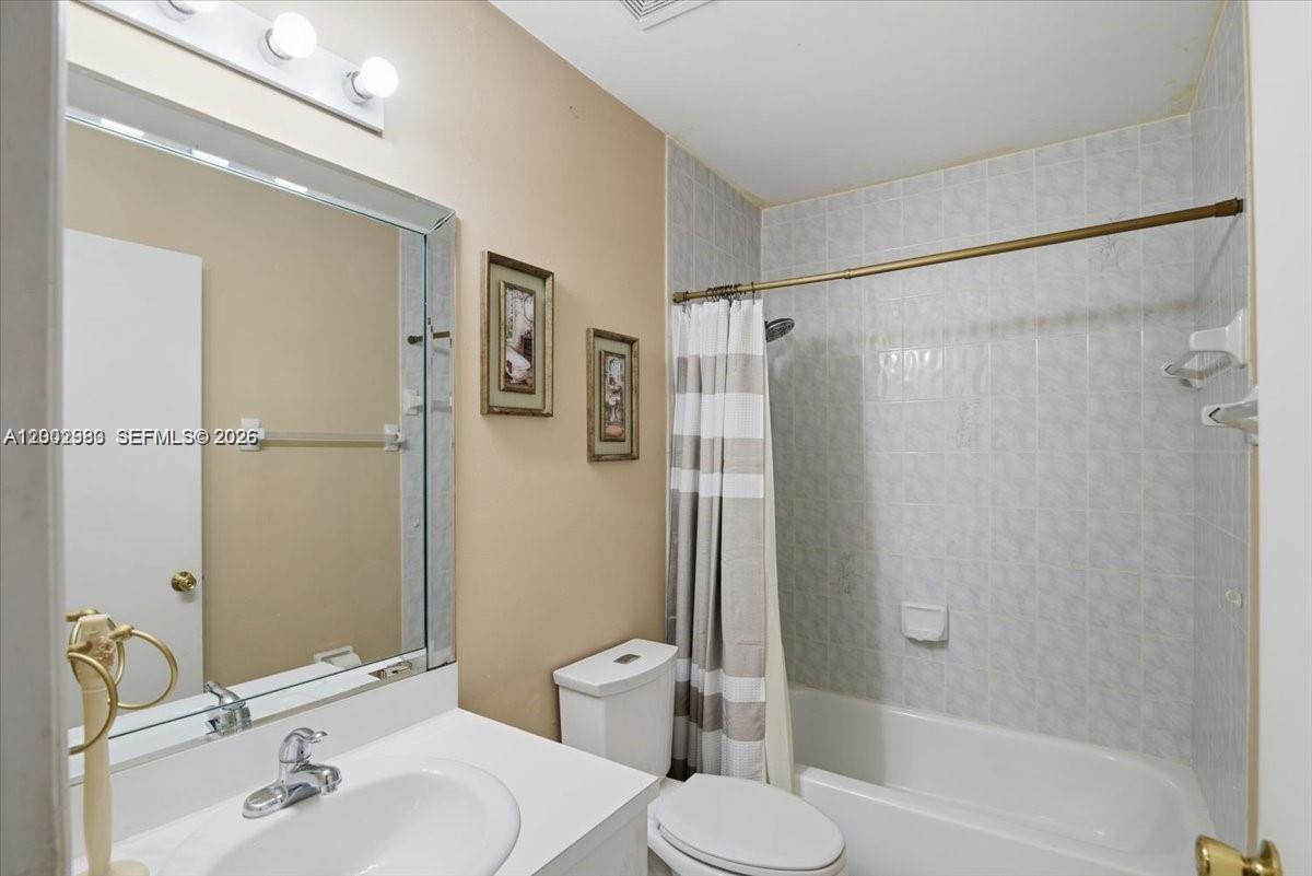 13741 Southwest 160th Terrace Miami, FL 33177 - Photo 8 of 34 a bathroom with a sink toilet and shower