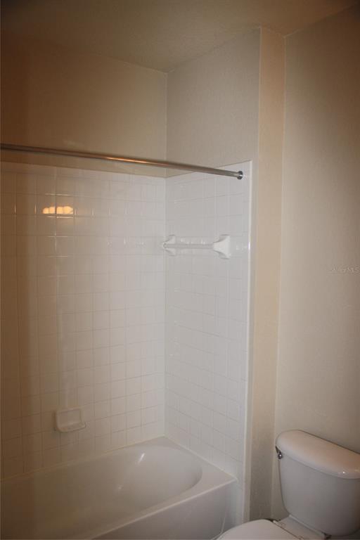 3621 Conroy Road, Unit 739 Orlando, FL 32839 - Photo 17 of 20 a bath room with a toilet