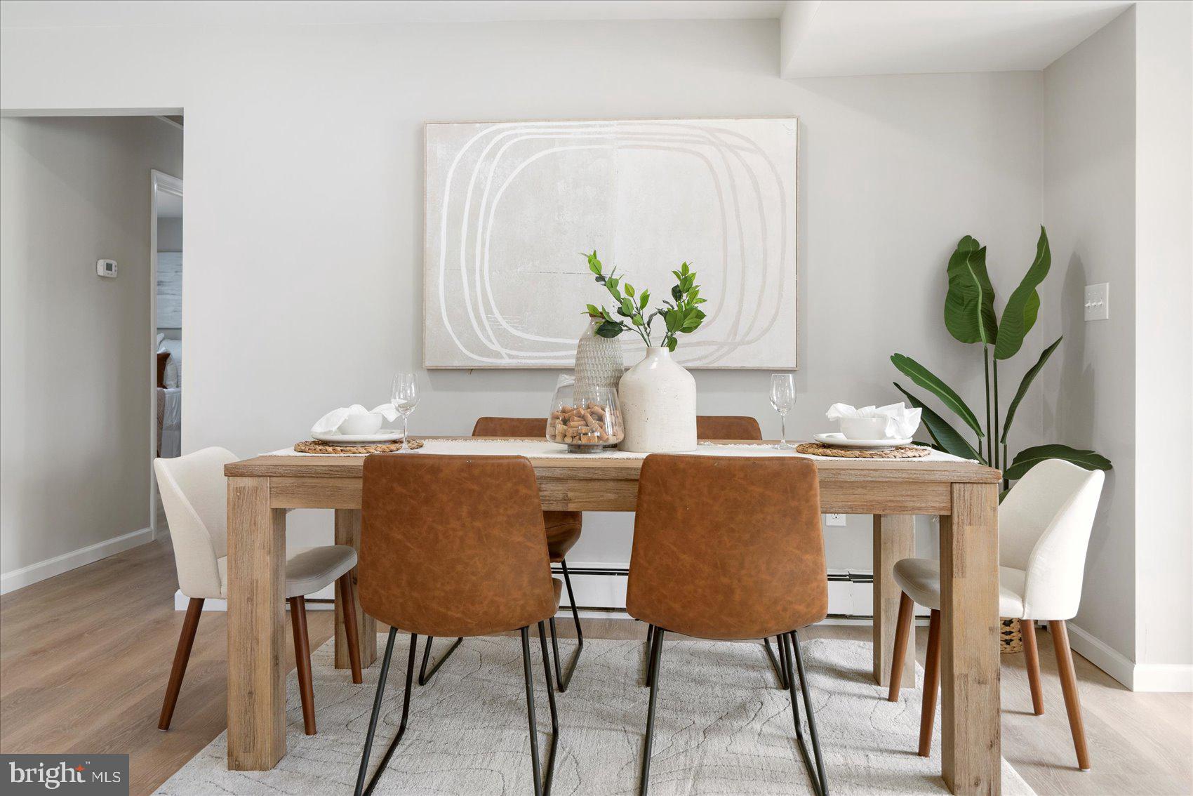 222 Magothy Road Pasadena, MD 21122 - Photo 12 of 30 a dining room with furniture and a potted plant