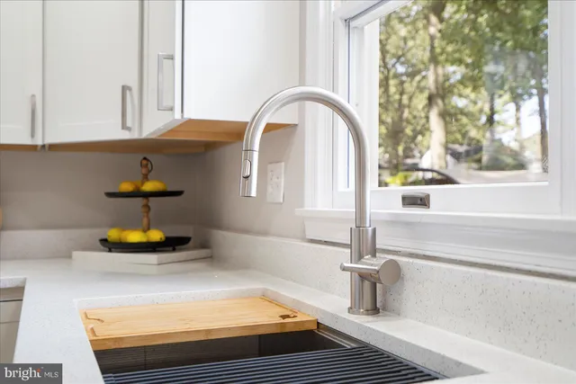 a kitchen with a sink and a window