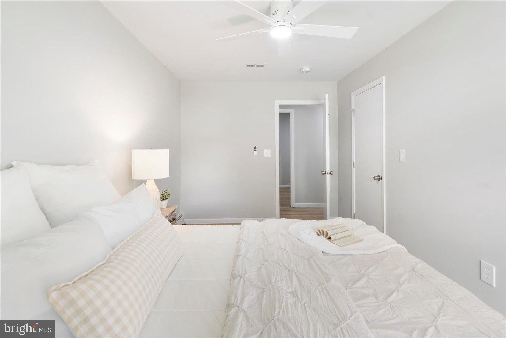 222 Magothy Road Pasadena, MD 21122 - Photo 21 of 30 a large white bed in a white room