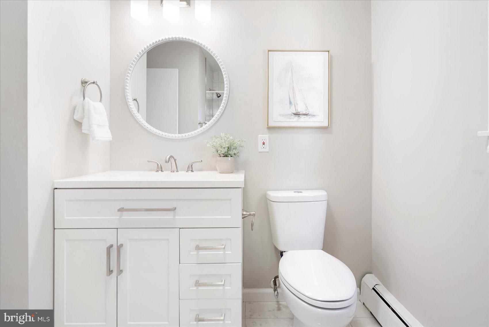 222 Magothy Road Pasadena, MD 21122 - Photo 26 of 30 a bathroom with a toilet a sink and mirror