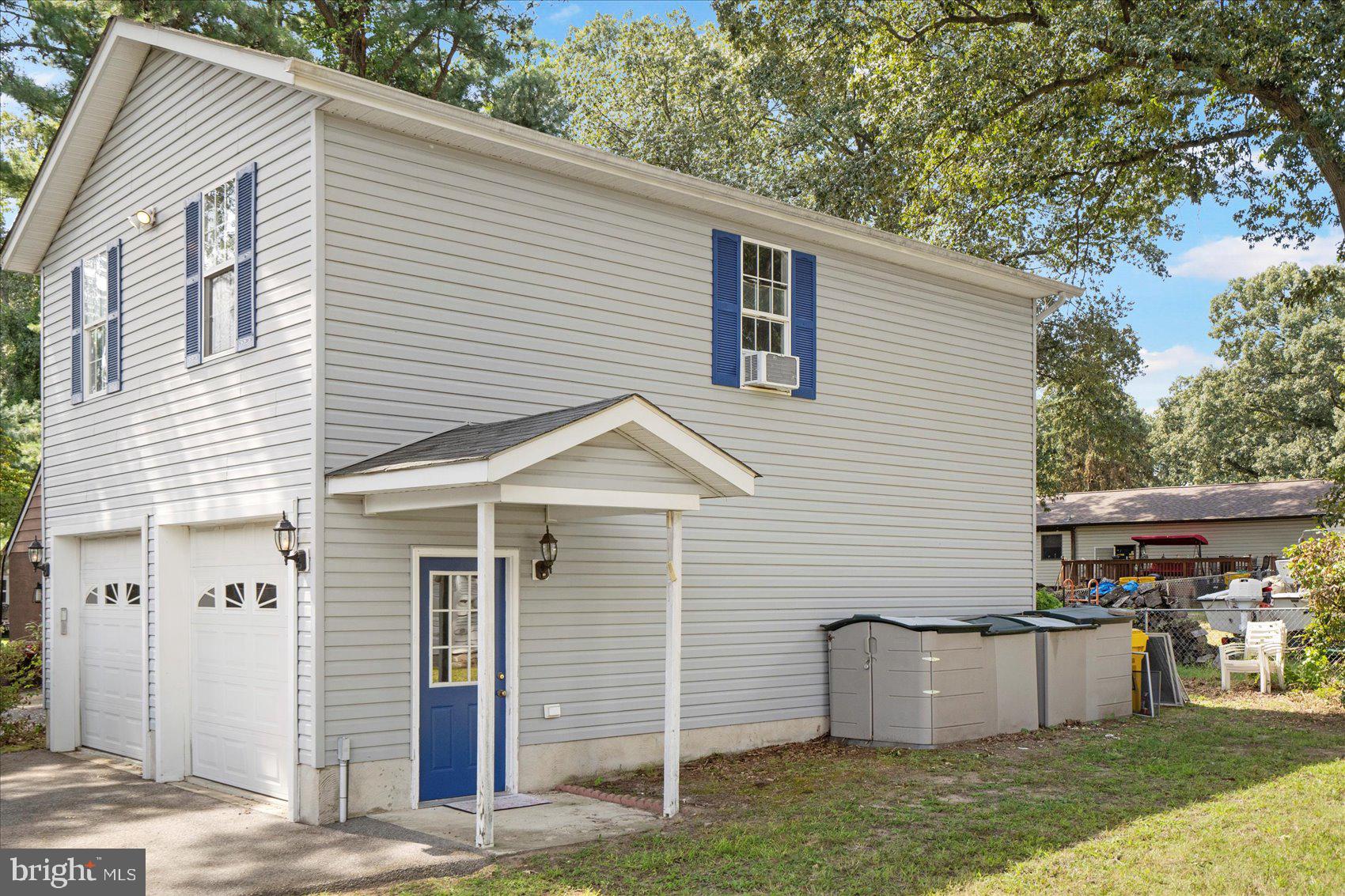 222 Magothy Road Pasadena, MD 21122 - Photo 29 of 30 a view of a white house with a yard and a large tree
