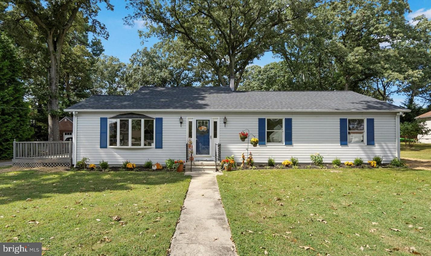 222 Magothy Road Pasadena, MD 21122 - Photo 3 of 30 a front view of a house with a garden