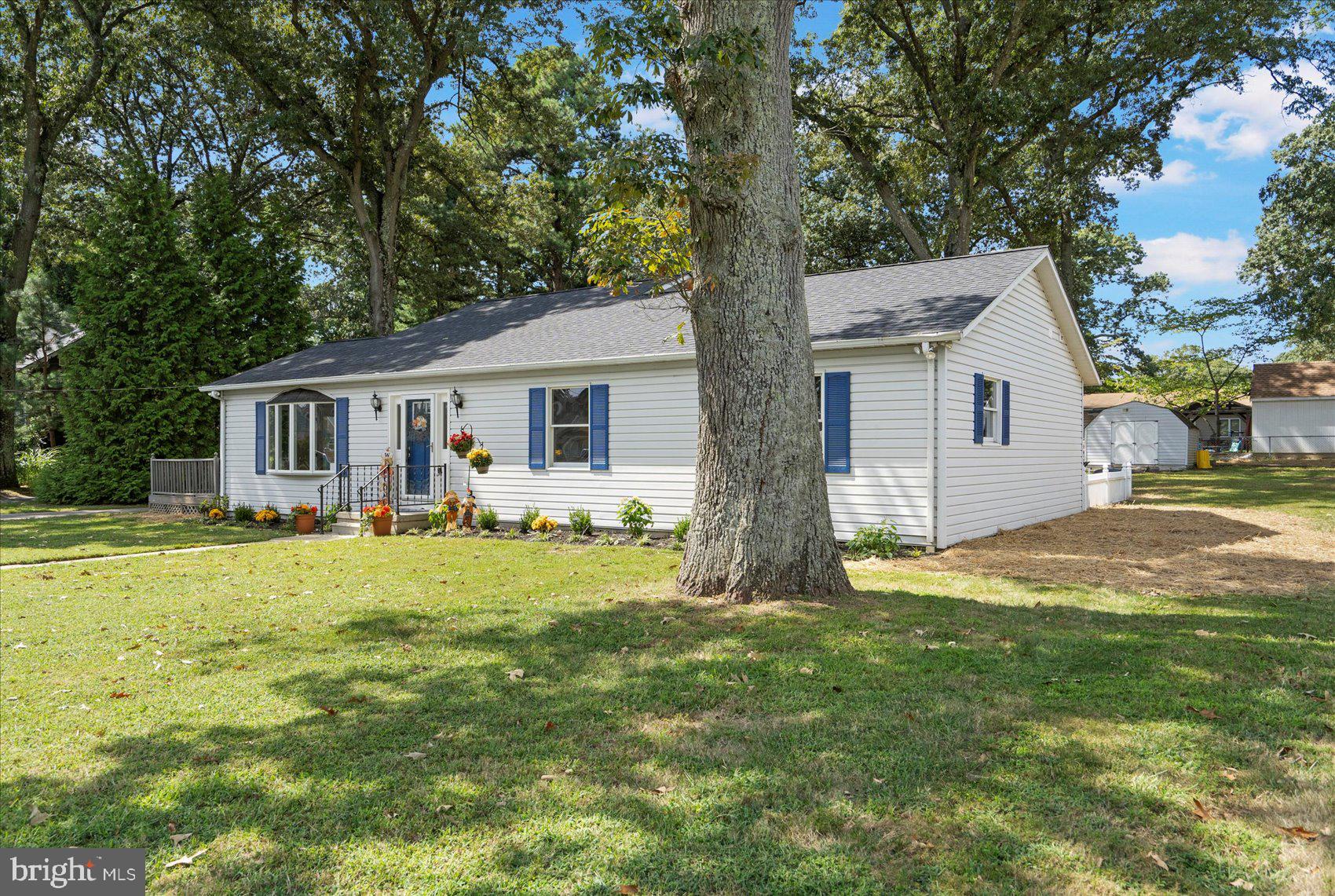 222 Magothy Road Pasadena, MD 21122 - Photo 4 of 30 a front view of a house with a garden and yard