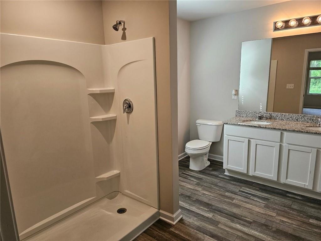 29 Danette Court Dallas, GA 30132 - Photo 11 of 14 a bathroom with a sink a toilet and a mirror