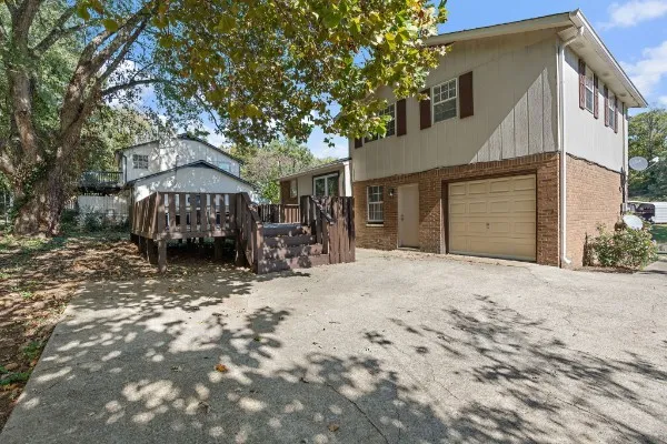 a view of a backyard with large trees