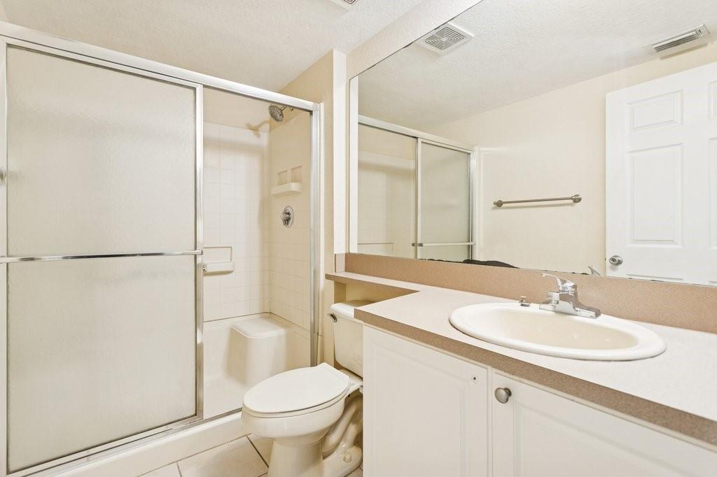 6384 West Sample Road, Unit 6384 Coral Springs, FL 33067 - Photo 4 of 8 a bathroom with a sink toilet and shower