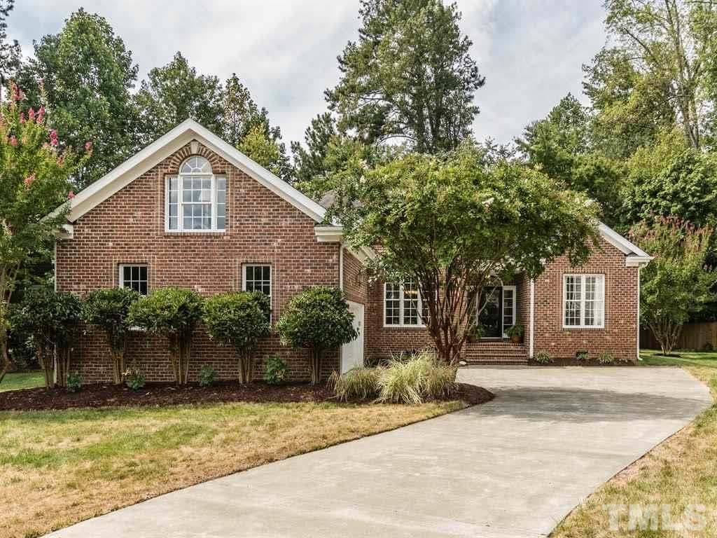 6304 Pleasant Creek Court Raleigh, NC 27613 - Photo 1 of 25 a front view of house with yard and trees around