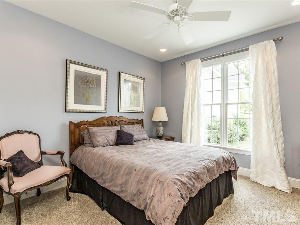 6304 Pleasant Creek Court Raleigh, NC 27613 - Photo 17 of 25 a bedroom with bed and a window