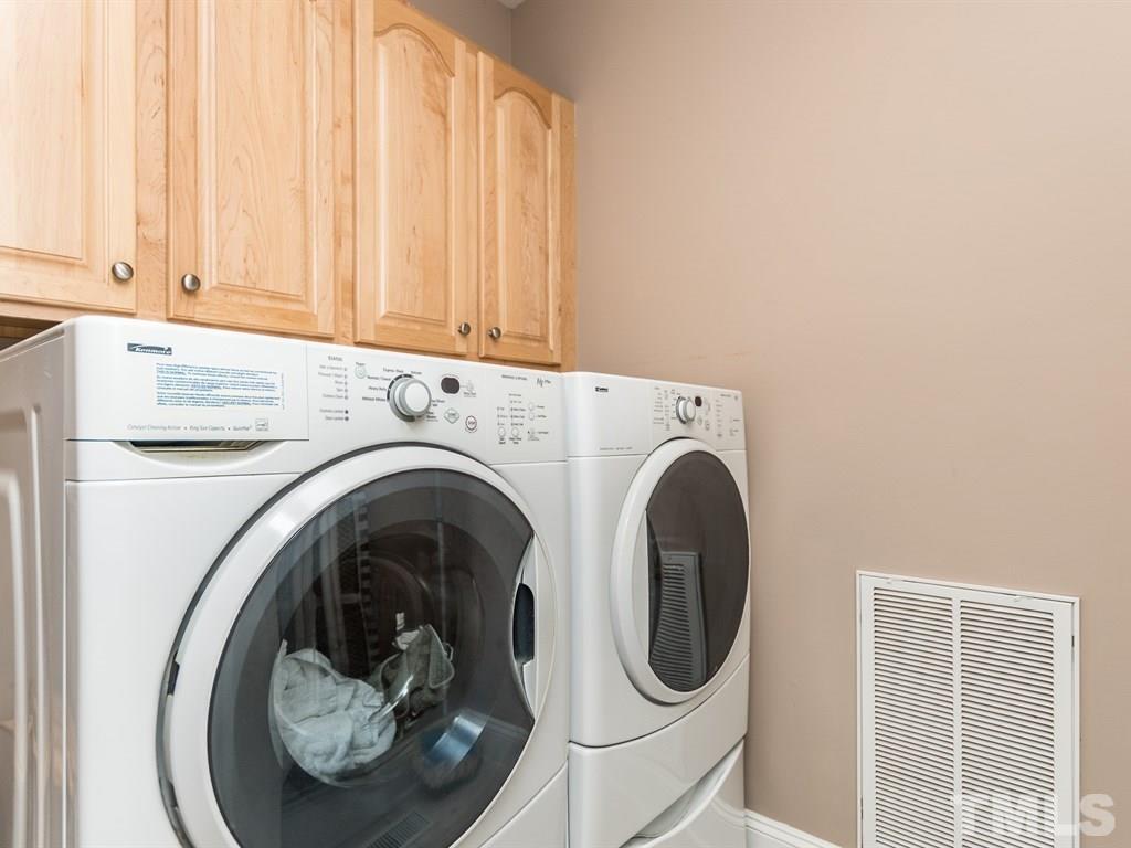 6304 Pleasant Creek Court Raleigh, NC 27613 - Photo 20 of 25 a utility room with dryer and washer