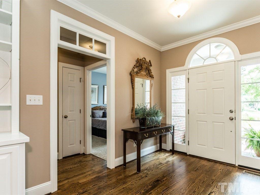 6304 Pleasant Creek Court Raleigh, NC 27613 - Photo 3 of 25 an empty room with wooden floor windows and entryway