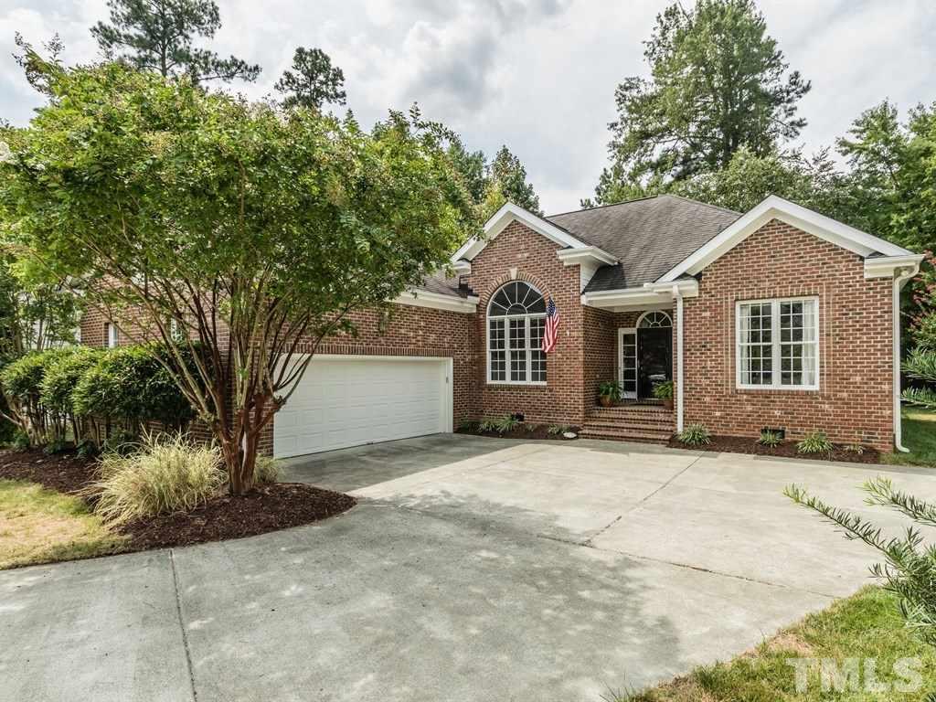 6304 Pleasant Creek Court Raleigh, NC 27613 - Photo 25 of 25 a front view of a house with a garden