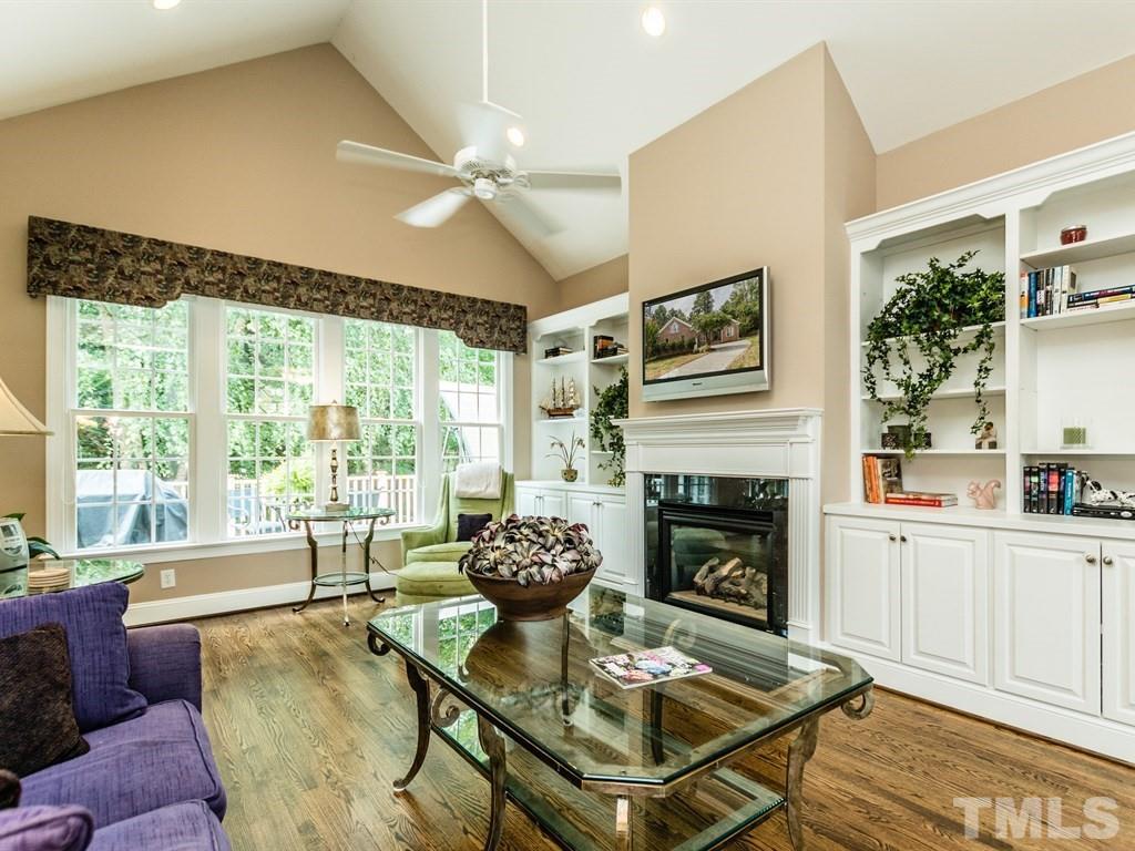 6304 Pleasant Creek Court Raleigh, NC 27613 - Photo 5 of 25 a living room with furniture fireplace and flat screen tv