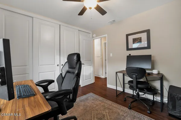 a work room with furniture and gym equipment