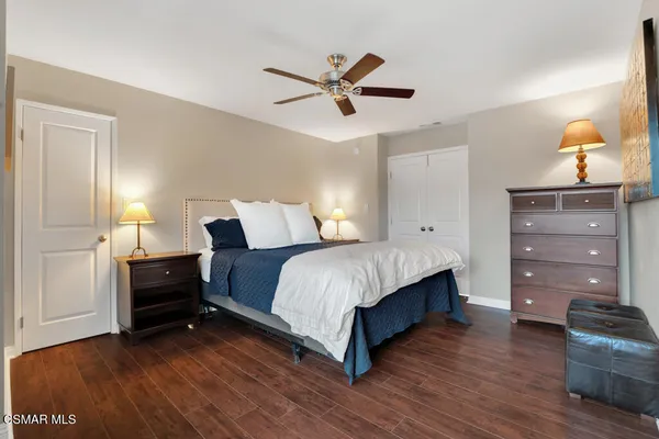 a bedroom with a bed and dresser