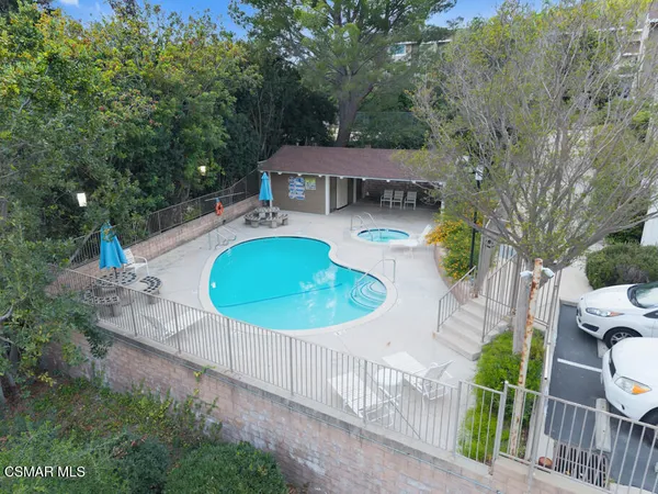 a view of a swimming pool with a patio