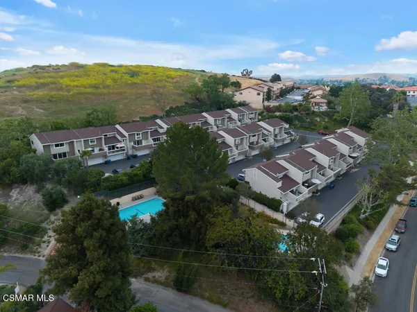 a view of a city with mountains in the background