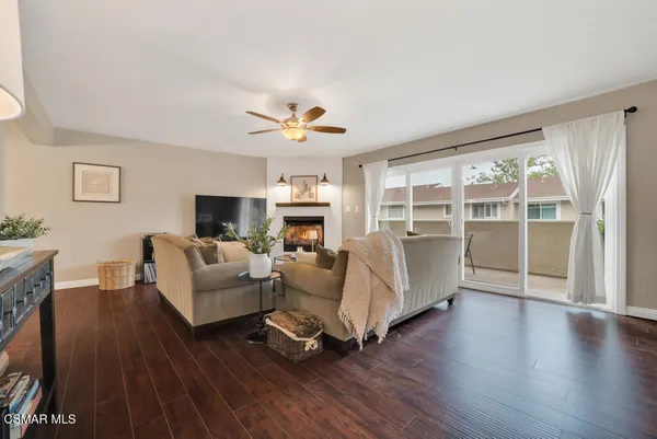 a view of a livingroom with furniture and a flat screen tv